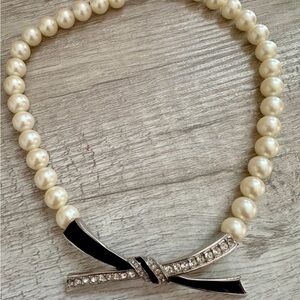 Elegant Pearl Necklace with Black Bow
